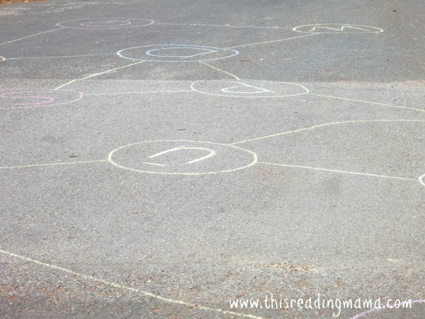 writing letters with sidewalk chalk for sight word game