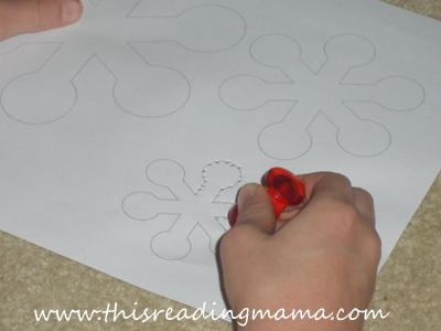 photo of using push pins to make holes in paper, fine motor