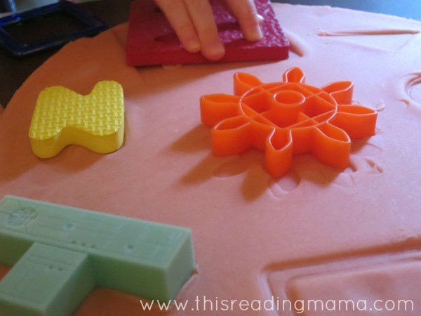 placing objects in playdough puzzles