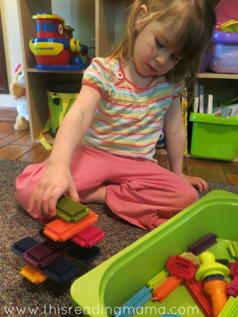 playing with quiet toys during read aloud time