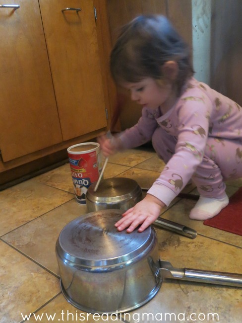 toddlers can play with pots and pans in the kitchen
