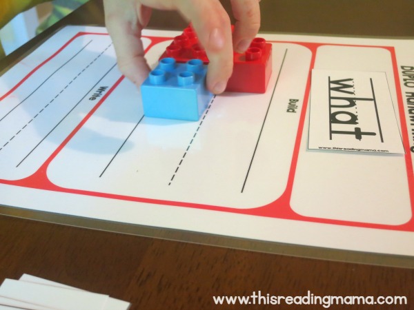 building the shape of the word with DUPLO bricks