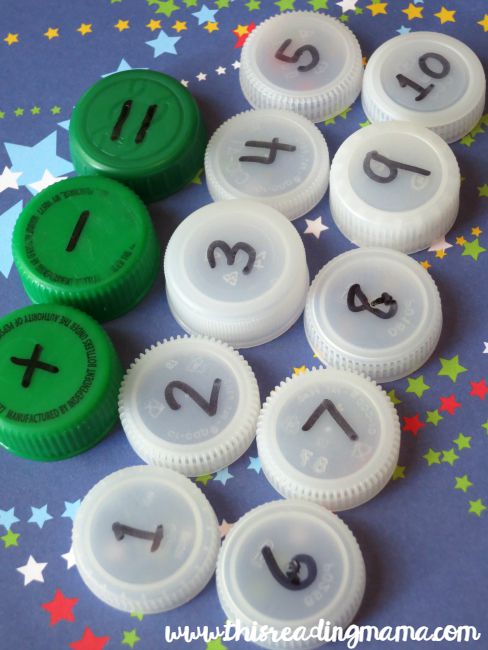 writing numbers on bottle caps - hands-on math