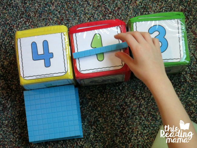 roll and build a 3-digit number with base ten blocks