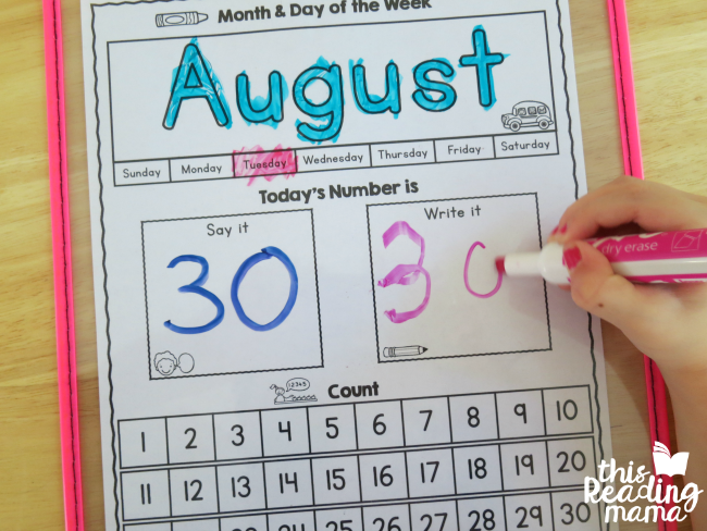 writing today's number on the preschool calendar page