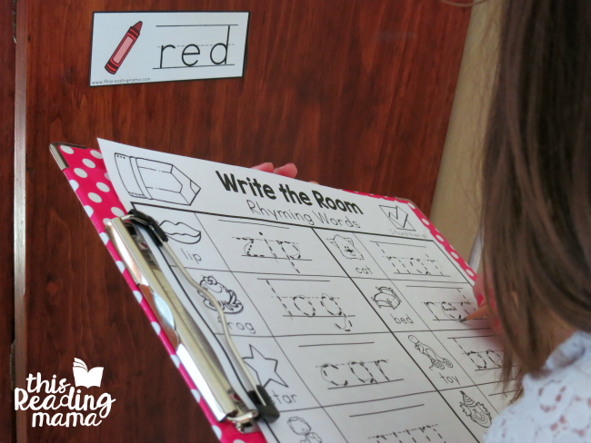 writing the rhyming words on recording sheet from write the room
